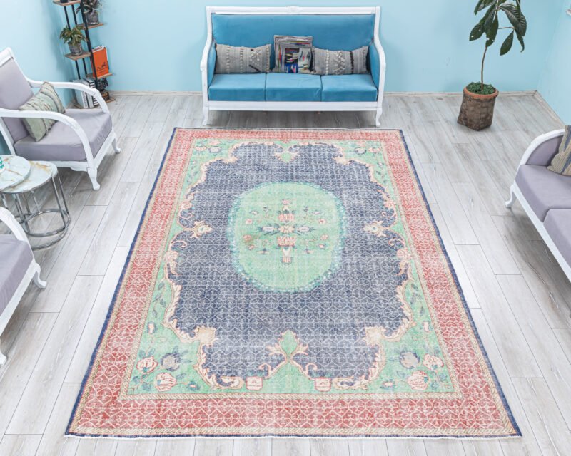 Handwoven Vintage Turkish Rug – Distressed Oriental Area Carpet with Oval Medallion and Bold Botanical Motifs in Navy, Green, and Pink Tones - detail view 2